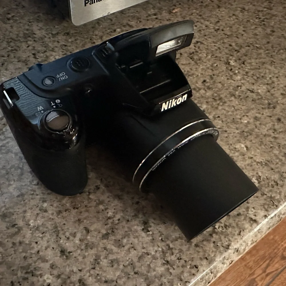 Great camera in great shape. 28x optical zoom wide lens. 20.2Mp point and shoot